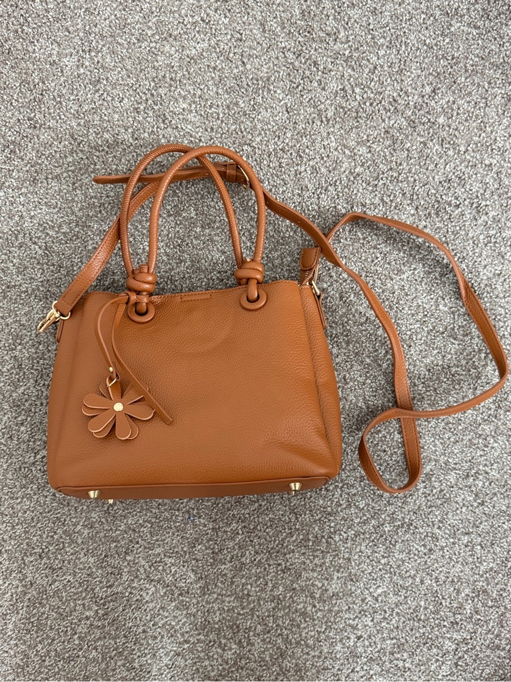 Classic Tan Leather Handbag with Floral Charm